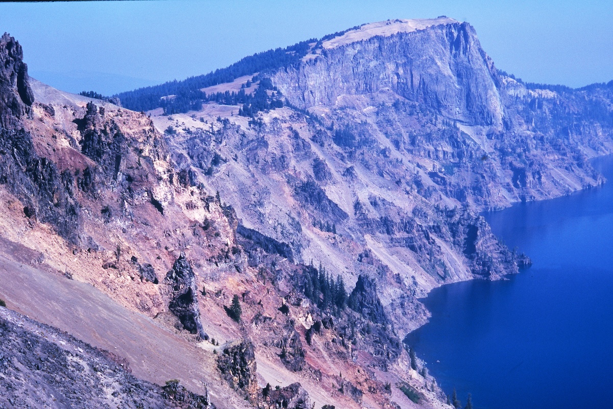 Crater Lake's cliffs and blue lake surface, Oregon's caldera landscape