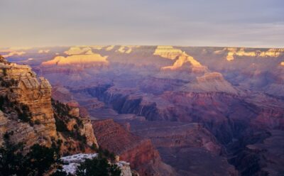 The Grand Canyon's rock walls, illuminated by the evening light, with shadows and highlights sharply defined