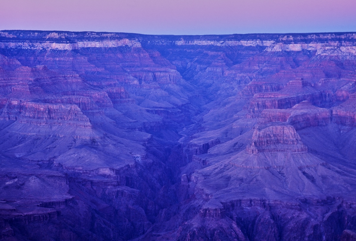The view overlooking the Grand Canyon's valley floor, bathed in the lingering light of dusk